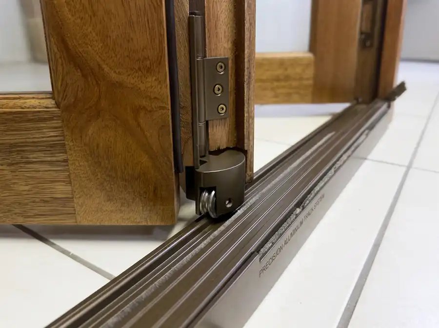 quality aluminium bottom track in wooden folding doors aluminium bottom sill in k parker joinery's wooden folding doors